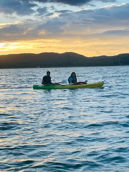 Kayaking at sunset during our Ramanagara outing. This day trip includes cycling and various water activities for a full day of fun.