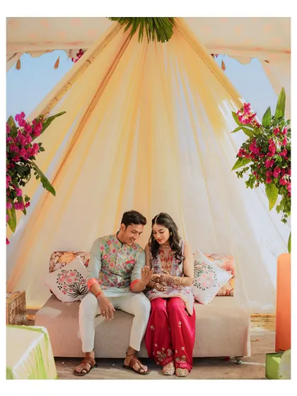 A quiet, seated portrait of the couple during their pre-wedding shoot, perfect for capturing a moment of shared peace.