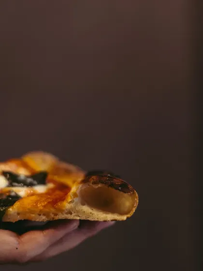 It's all about that crust. A side view showing the puffy, airy edge of my Neapolitan-style pizza. This is the sign of a perfectly fermented and baked dough.