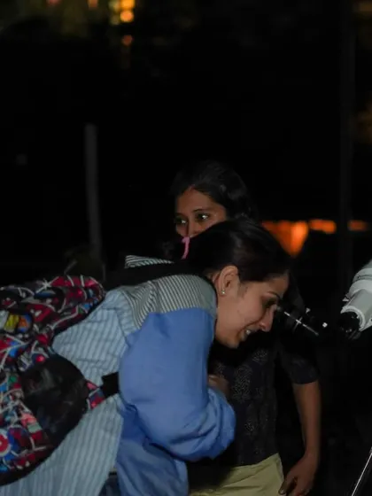 The look of awe on a guest's face as she peers through the telescope for the first time.
