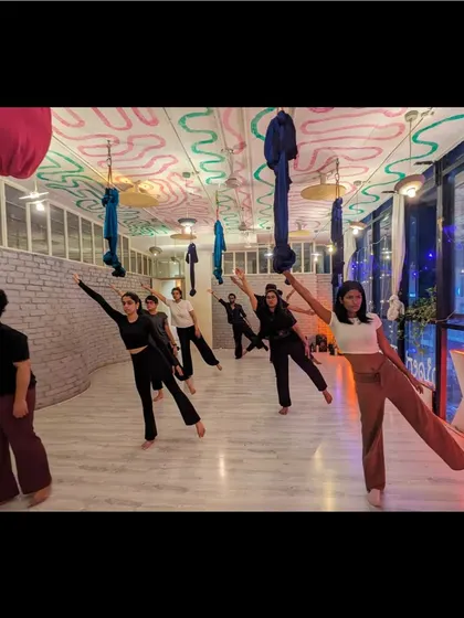 The whole class moves together, creating a beautiful visual of unity and shared purpose in our beginner contemporary session.