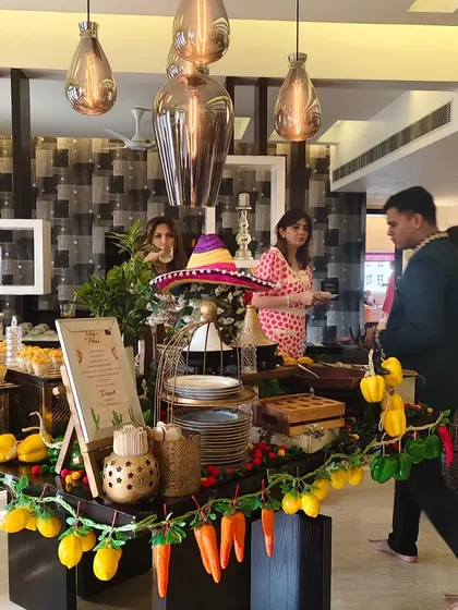 We specialize in creating fully-themed culinary experiences. This vibrant Mexican grazing table shows how we integrate food and decor, with a festive setup featuring colorful garlands, sombreros, and a delicious spread to match the fiesta vibe.