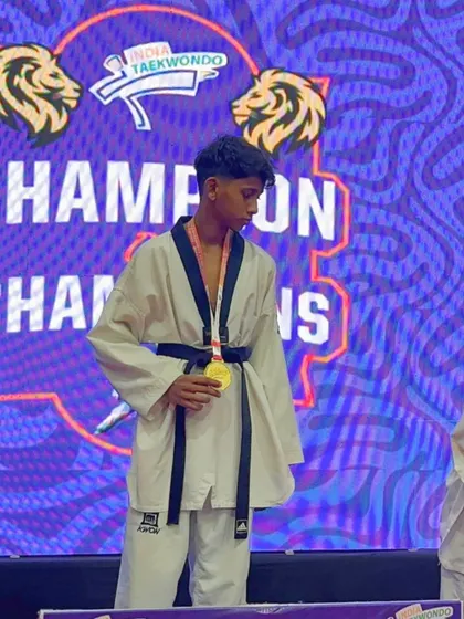 A close up of our gold medalist at the 'Champion of Champions' event. The focus and pride in his eyes tell the story of a journey filled with hard work and the spirit to win.
