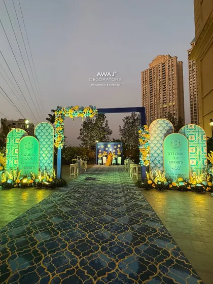 The Haldi walkway at dusk, with the lighting creating a dramatic and inviting path for guests to enter the celebration.
