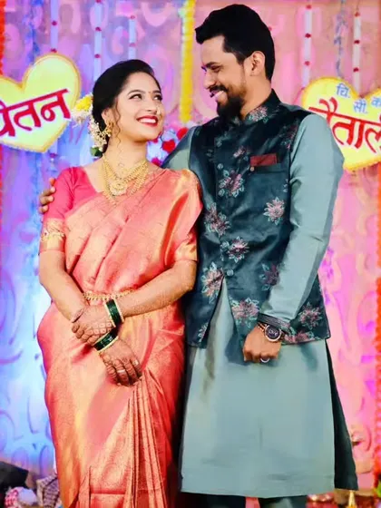 A happy couple portrait from an engagement ceremony, with the bride looking stunning in her South Indian style saree.