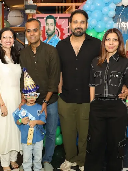 Family and friends gather for a group photo with the birthday boy.