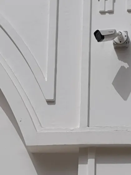 Another view of the same cleanly installed camera. The shadow shows it is a sunny day, and these cameras handle bright light and shadows well.