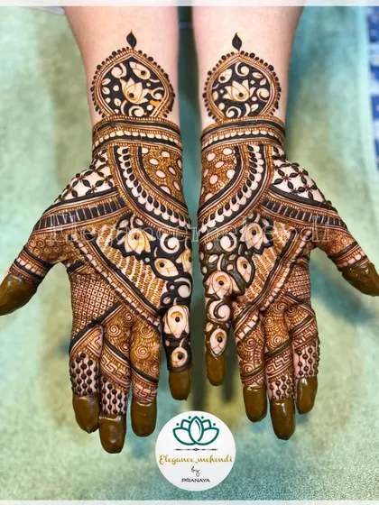 The final look of the Indian design with lotus motifs, showing the beautiful symmetry on both hands.