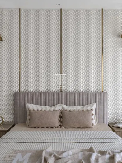 This bedroom features intricate 3D paneling behind the bed, creating a stunning focal point. We crafted the fluted bed and matching bedside tables to complement the detailed wall, resulting in a space that is rich in texture and sophistication.