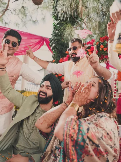 Fun with friends and family is what a Haldi is all about. The couple's comfortable yet stylish outfits allow them to enjoy every moment.