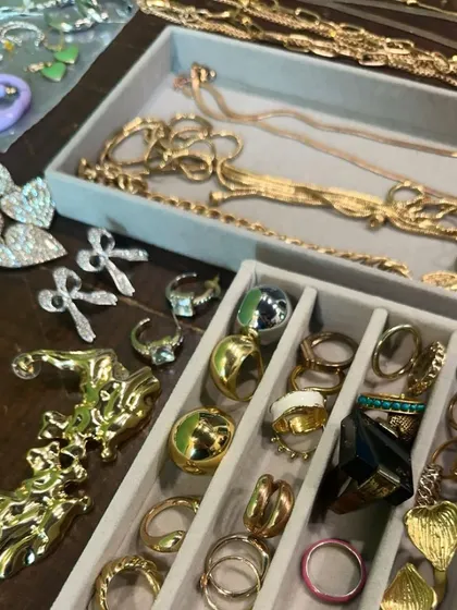 The finishing touches are everything. A look inside my accessory kit on a shoot day, filled with a variety of gold chains, statement rings, and bold earrings to complete each outfit.