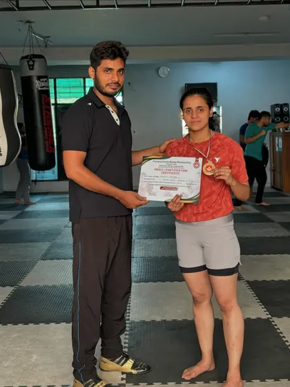 Posing with Saniya and her gold medal and certificate. She was also named the best boxer in the senior women's category.
