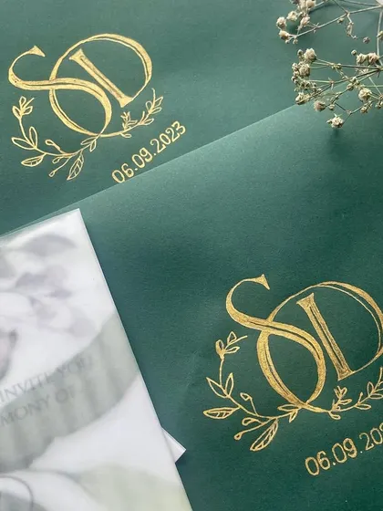 This engagement announcement for Disha & Sumanth was full of dreamy details. The suite included a custom gold-inked logo on a deep green envelope, a floral vellum wrap, and a personalized wax seal.