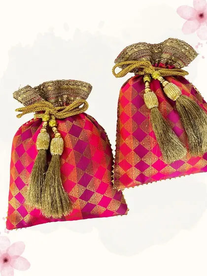 These brocade potlis in a vibrant rani pink are perfect for adding a pop of color to your outfit. The golden diamond pattern and tassels make them a festive and eye-catching choice.