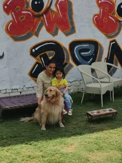 A quiet moment in front of our signature graffiti wall. Our space offers many spots for you and your pet to relax and take pictures.
