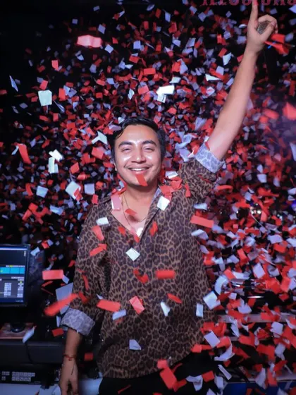 Another angle of the confetti explosion. The pure joy on my face reflects the energy of the crowd. These are the moments I live for as a DJ.