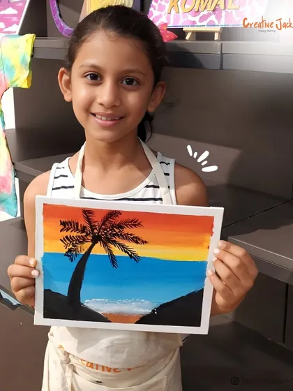 A young girl smiles as she holds her painting of a palm tree against a sunset, a beautiful piece she created in one of my kids' art classes.
