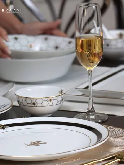 A toast to fine living with my Ichkan collection. This tablescape features dinnerware with a modern honeycomb and bee motif, blending heritage artistry with a touch of contemporary charm.