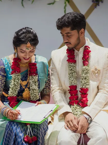 The official signing of the marriage register, a quiet moment amidst the grand celebrations. I ensure every part of the day, big and small, is thoughtfully planned.