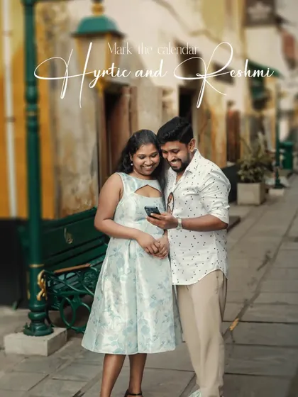A creative "save the date" concept, with the couple sharing a moment while looking at a phone in a picturesque alley.