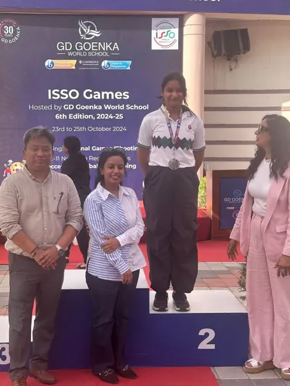Laakhi Maheshwari on the podium after winning a Silver Medal at the All India ISSO Shooting Championships.