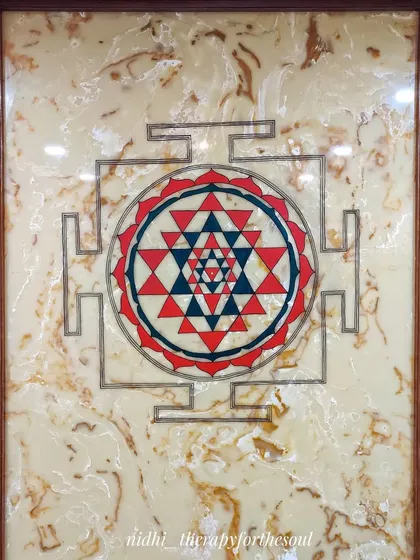 The Sri Chakra mural installed in a residence's pooja space. Painting on this smooth, glossy surface was a challenge, but the result is a sharp and powerful spiritual centerpiece.