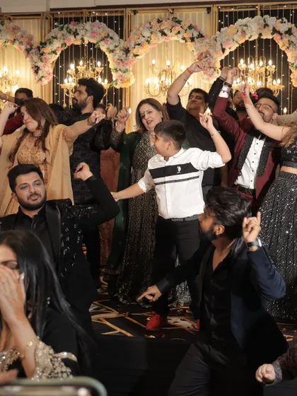 The entire dance floor filled with family and friends. Our goal is to get everyone up and celebrating together.