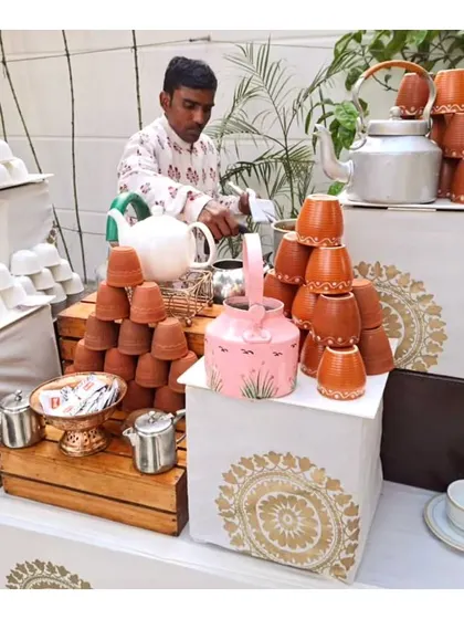 Our charming and rustic live tea station, featuring hand-painted kettles and traditional clay kulhads, perfect for serving masala chai at a winter brunch or high tea.