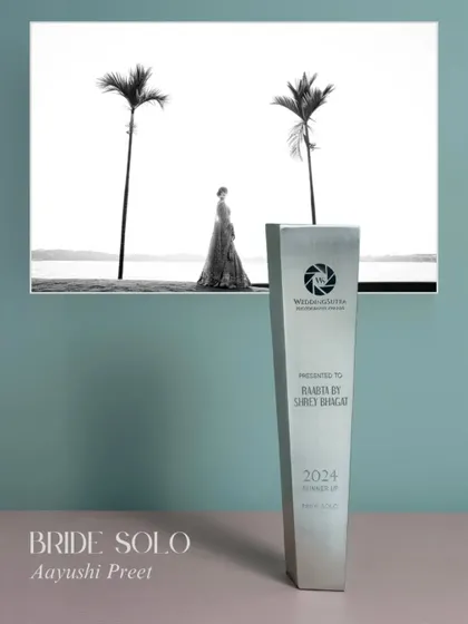 Our award for 'Bride Solo' portrait. This image of Aayushi against the stark backdrop of the sea and palm trees captures the kind of powerful, solitary beauty we love to create.