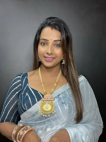 A full view of the festive Teej look. The makeup is fresh and bright, perfect for celebrating.