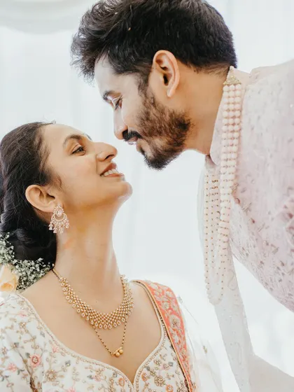 An intimate close-up of the couple, their eyes locked in a loving gaze. We focus on capturing the deep connection and emotion between two people.