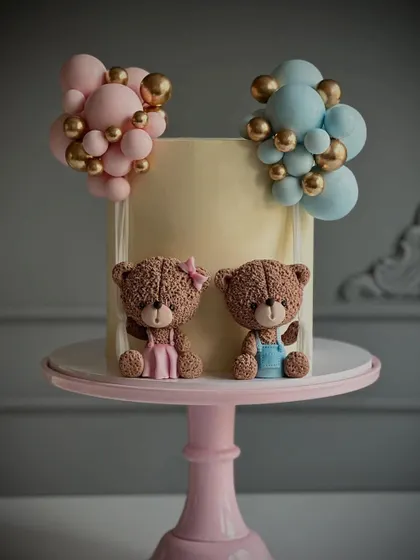 A cute teddy bear themed cake perfect for a gender reveal celebration.