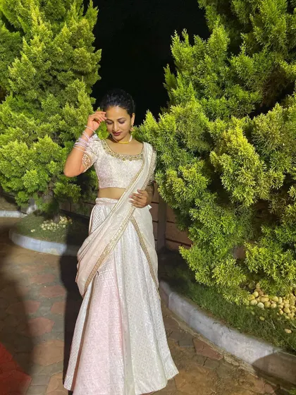 The clean lines and classic color of this lehenga make it a timeless choice.