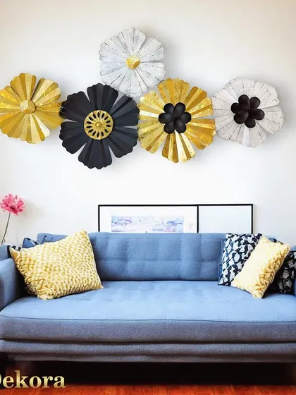 This creative wall decor adds a touch of modern elegance to this living room setup.