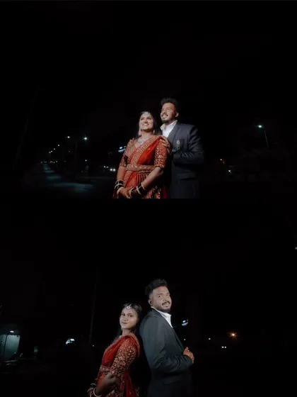 A dramatic, wide-angle shot of the couple posing on a street at night for their reception photoshoot.