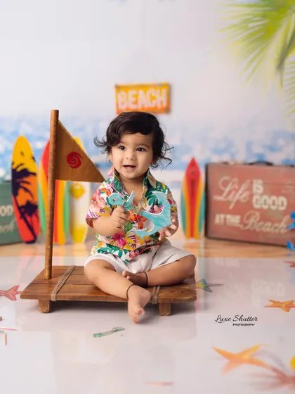 Another shot from the beach setup, this time with a small wooden raft, adding to the nautical adventure theme.