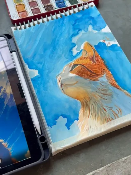 The painting on my sketchbook next to the digital reference. I can work from any photo you provide to create a custom pet portrait.