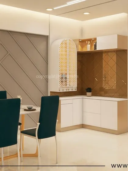 The dining area in our 'Konark Oasis' project, featuring a simple table with dark chairs and an elegant arched pooja unit with gold-toned jali work.