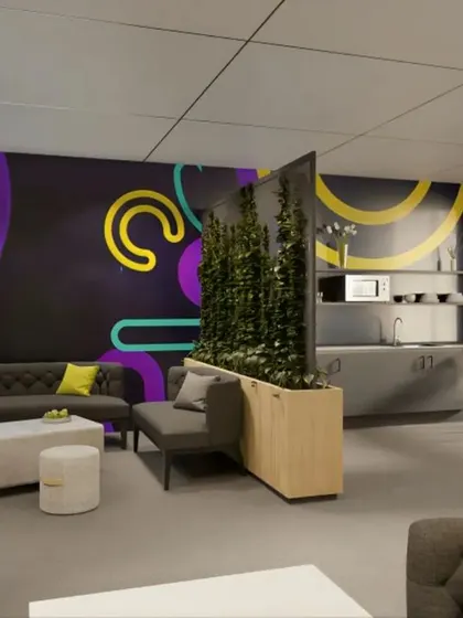 This office breakout area is designed to be a versatile space for relaxation and informal collaboration. It features comfortable lounge seating, a small pantry, and a bold, graphic wall mural that injects energy and brand personality into the workplace.