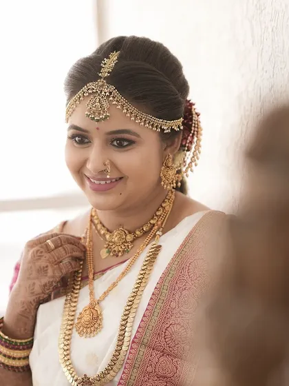 A beautiful reflection shot of the bride. Her airbrush makeup looks perfect from every angle.