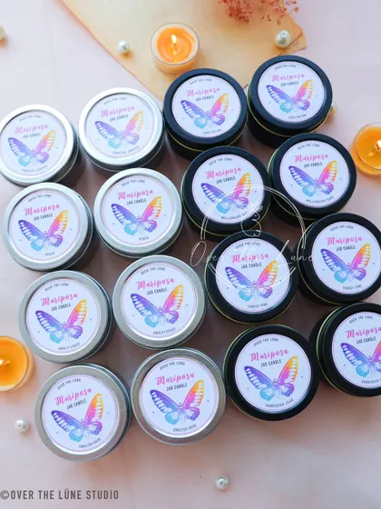 The full assortment of my 'Mariposa' butterfly jar candles. They come in both silver and black tins, with a beautiful holographic butterfly label.