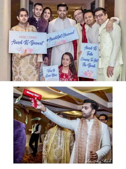The groom's squad, or "Groom's Tribe," poses with fun signs before the Baraat. The money gun adds a playful, modern touch to the festivities.