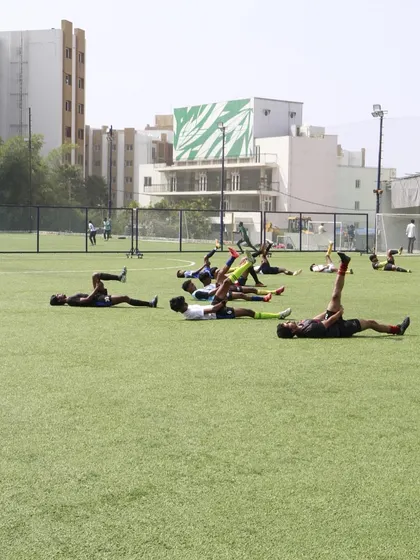 Stretching and recovery are crucial parts of our training regimen. Players prepare their bodies for the intense drills and gameplay during our trials.
