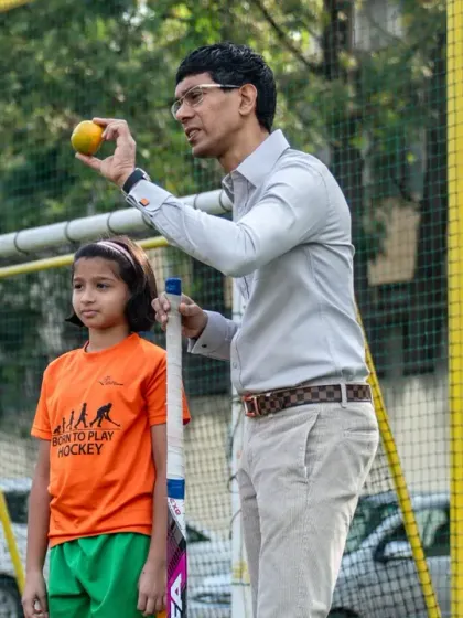 A young camper assists Ryan Fernando during a nutrition workshop. We involve our players directly, making the lessons memorable and empowering them to make healthier choices.
