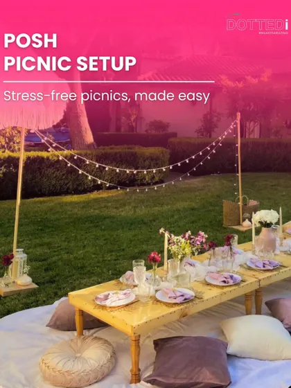 I turn simple picnics into posh, luxurious experiences. This setup features a low wooden table, plush floor cushions, elegant place settings, and string lights, creating a comfortable and stylish outdoor lounge for any celebration.