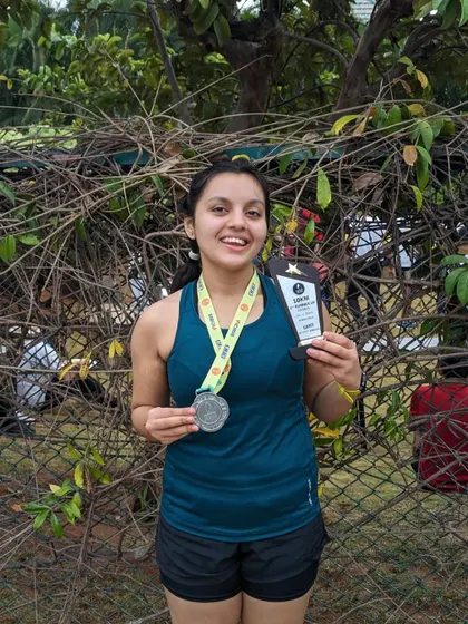 A smile of a winner. This runner earned her podium spot at the Kaveri Trail 10k through sheer hard work.