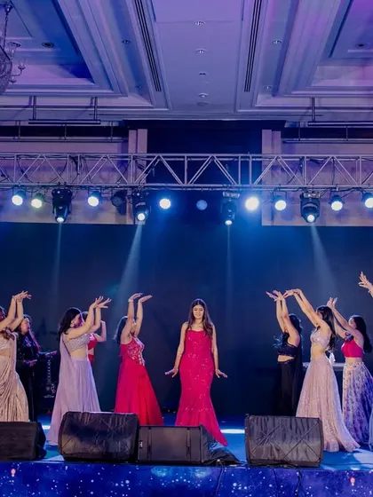 The full bride tribe on stage, perfectly in sync. I love creating these large group performances that showcase the power and unity of the bridesmaids.