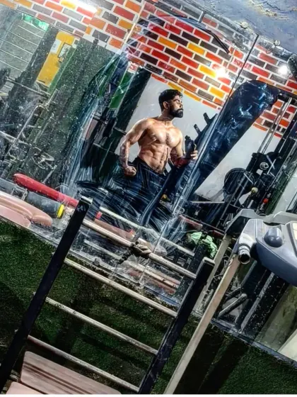 Slowly, slowly, progress is made. A reflection in the gym mirror showing my physique.