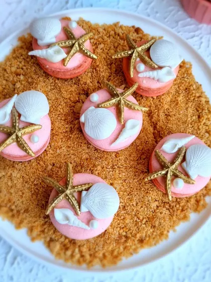 Ocean-themed macarons, decorated with tiny, hand-sculpted fondant shells and starfish. I teach how to make stable macaron shells and decorate them for any occasion.