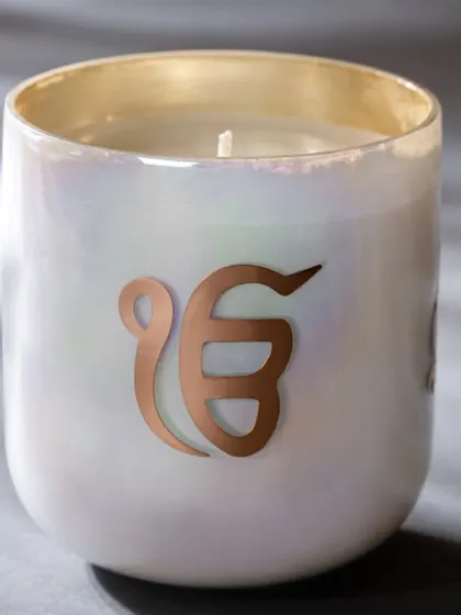 This 'Ek Onkar' candle from my spiritual collection is designed for meditative moments. The exquisitely fragranced candle helps facilitate inner peace and clarity, turning your space into a tranquil sanctuary.